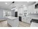 New kitchen with stainless appliances, a large island, white cabinets, and a black faucet at 6001-Mh13A S Kings Hwy., Myrtle Beach, SC 29575