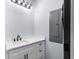 Laundry area with white cabinets and a dark faucet with a modern light fixture at 6001-Mh13A S Kings Hwy., Myrtle Beach, SC 29575