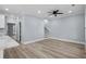 Open-concept living area features stylish floors, neutral paint, and a staircase leading upstairs at 6001-Mh13A S Kings Hwy., Myrtle Beach, SC 29575