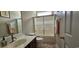 Bathroom featuring a vanity with a framed mirror, a shower/tub combo, and neutral-toned walls at 6400 Longwood Dr., Murrells Inlet, SC 29576