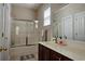 Bright bathroom with a shower/tub combination, vanity with quartz countertop and a large mirror at 6400 Longwood Dr., Murrells Inlet, SC 29576