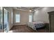 Spacious primary bedroom with two windows, sliding glass door to patio, and a ceiling fan at 6400 Longwood Dr., Murrells Inlet, SC 29576