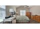 Bright bedroom with vaulted ceiling, ceiling fan, stylish decor and plenty of closet space for storage at 6400 Longwood Dr., Murrells Inlet, SC 29576