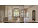Elegant dining room with coffered ceilings, tile floors, and an open floor plan at 6400 Longwood Dr., Murrells Inlet, SC 29576