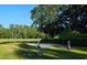 Picturesque golf course view, featuring a serene pond, manicured green, and lush trees at 6400 Longwood Dr., Murrells Inlet, SC 29576