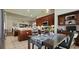Open floor plan kitchen featuring dark wood cabinets, stainless steel appliances, island and eat-in table at 6400 Longwood Dr., Murrells Inlet, SC 29576