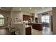 Modern kitchen featuring dark wood cabinets, a center island, and stainless steel appliances at 6400 Longwood Dr., Murrells Inlet, SC 29576