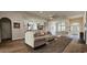 Inviting living room with hardwood floors, comfortable seating and a view to the open floor plan and entryway at 6400 Longwood Dr., Murrells Inlet, SC 29576