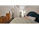 Bright bedroom with dresser, nightstand, and access to an en-suite bathroom, offering comfortable living at 6400 Longwood Dr., Murrells Inlet, SC 29576
