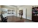 Office with a large desk, built-in shelving, and an open doorway to other areas of the home at 6400 Longwood Dr., Murrells Inlet, SC 29576