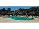 Sparkling community pool with lounge chairs and umbrellas, offering a refreshing escape on sunny days at 6400 Longwood Dr., Murrells Inlet, SC 29576