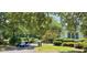 Charming street with golf cart, lush landscaping, and inviting homes in a peaceful neighborhood at 6400 Longwood Dr., Murrells Inlet, SC 29576