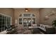 Relaxing sunroom with comfortable outdoor seating and dining, lots of windows and a ceiling fan at 6400 Longwood Dr., Murrells Inlet, SC 29576