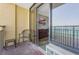 Balcony view into the suite featuring an entertainment center and dining area with ocean view through the sliding glass door at 6900 N Ocean Blvd. # 842, Myrtle Beach, SC 29577