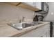 Close-up on kitchen sink with granite countertop and stainless steel faucet at 6900 N Ocean Blvd. # 842, Myrtle Beach, SC 29577
