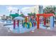 Colorful splash pad and waterpark at the community pool with tropical palms nearby at 6900 N Ocean Blvd. # 842, Myrtle Beach, SC 29577