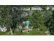 Aerial shot of a community pool with surrounding picnic area and lush trees and landscaping at 695 Riverwalk Dr. # 101, Myrtle Beach, SC 29579