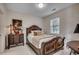 Bedroom features decorative bed frame, dresser, and marble flooring at 695 Riverwalk Dr. # 101, Myrtle Beach, SC 29579