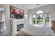 Bedroom features decorative fireplace, TV, and large window with natural light at 695 Riverwalk Dr. # 101, Myrtle Beach, SC 29579
