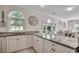 Well-lit kitchen with ample counter space, modern appliances, and views to living spaces at 695 Riverwalk Dr. # 101, Myrtle Beach, SC 29579