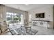 Modern living room with access to patio, open view to the bedroom, and decor elements at 695 Riverwalk Dr. # 101, Myrtle Beach, SC 29579