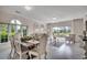Bright living space with decorative chairs, luxury flooring, windows with natural light at 695 Riverwalk Dr. # 101, Myrtle Beach, SC 29579