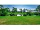 Picturesque view of a lush green landscape with a tranquil pond reflecting the surrounding trees and sky at 695 Riverwalk Dr. # 101, Myrtle Beach, SC 29579