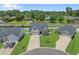 Aerial view of a single-Gathering home showcases its well-manicured lawn, complemented by mature trees and a driveway at 752 Hobonny Loop, Longs, SC 29568
