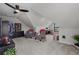 Bright attic area features neutral carpeting, vaulted ceilings, fan, closet, and desk area at 752 Hobonny Loop, Longs, SC 29568
