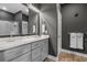 Bathroom with double vanity sinks, modern lighting, and granite countertops at 752 Hobonny Loop, Longs, SC 29568