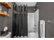 Clean bathroom featuring a tub with shower, and a gray-themed decor at 752 Hobonny Loop, Longs, SC 29568