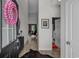 Inviting entryway featuring an elongated foyer, high ceilings, and stylish decor at 752 Hobonny Loop, Longs, SC 29568