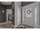 Bright entryway showcases detailed trim, a white door, and a glimpse into the bedroom at 752 Hobonny Loop, Longs, SC 29568