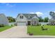 Charming single Gathering home with a manicured lawn and two car garage at 752 Hobonny Loop, Longs, SC 29568