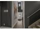 Hallway with dark walls, light floors, staircase and modern decor leading to front entrance at 752 Hobonny Loop, Longs, SC 29568