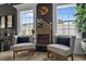 Cozy living room with fireplace, accent chairs, natural light and stylish decor at 752 Hobonny Loop, Longs, SC 29568