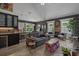 Open-concept living room area with modern furnishings, fireplace and adjacent kitchen at 752 Hobonny Loop, Longs, SC 29568