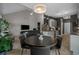 Open concept living space featuring a dining area, kitchen, and comfortable living room with vaulted ceiling at 752 Hobonny Loop, Longs, SC 29568