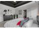Bright main bedroom with plush bedding, stylish decor, and an ensuite bathroom at 752 Hobonny Loop, Longs, SC 29568