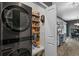 Organized pantry with snack shelving, next to a stackable washer and dryer at 752 Hobonny Loop, Longs, SC 29568