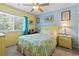 Bright bedroom features a beach-themed decor with a large window letting in plenty of natural light at 81 Shadow Moss Pl. # 81, North Myrtle Beach, SC 29582
