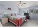 A bright bedroom features a ceiling fan, a comfortable bed, and a window for natural light at 81 Shadow Moss Pl. # 81, North Myrtle Beach, SC 29582