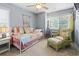 Bedroom features a comfortable daybed, charming decor, and a cozy wicker chair with ottoman at 81 Shadow Moss Pl. # 81, North Myrtle Beach, SC 29582