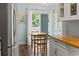 Cozy breakfast nook with natural light, wooden table, and backyard access at 81 Shadow Moss Pl. # 81, North Myrtle Beach, SC 29582