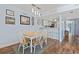 Open dining area with a wooden table, seating for six, and seamless access to the adjacent kitchen at 81 Shadow Moss Pl. # 81, North Myrtle Beach, SC 29582