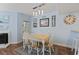 Bright dining room featuring stylish lighting, fireplace, and coastal-inspired decor at 81 Shadow Moss Pl. # 81, North Myrtle Beach, SC 29582