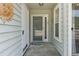 Inviting home entrance with a screen door and decorative sun accent at 81 Shadow Moss Pl. # 81, North Myrtle Beach, SC 29582