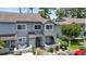 Charming two-story townhome featuring a well-maintained exterior with inviting front patio and beautiful landscaping at 81 Shadow Moss Pl. # 81, North Myrtle Beach, SC 29582