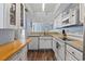 Efficient kitchen design with bright cabinets, stainless steel appliances, and a convenient breakfast bar area at 81 Shadow Moss Pl. # 81, North Myrtle Beach, SC 29582