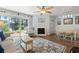 Inviting living room and dining area with stylish decor, a fireplace, and sliding glass doors to the patio at 81 Shadow Moss Pl. # 81, North Myrtle Beach, SC 29582